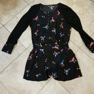 Black long sleeve romper with multi colored birds
